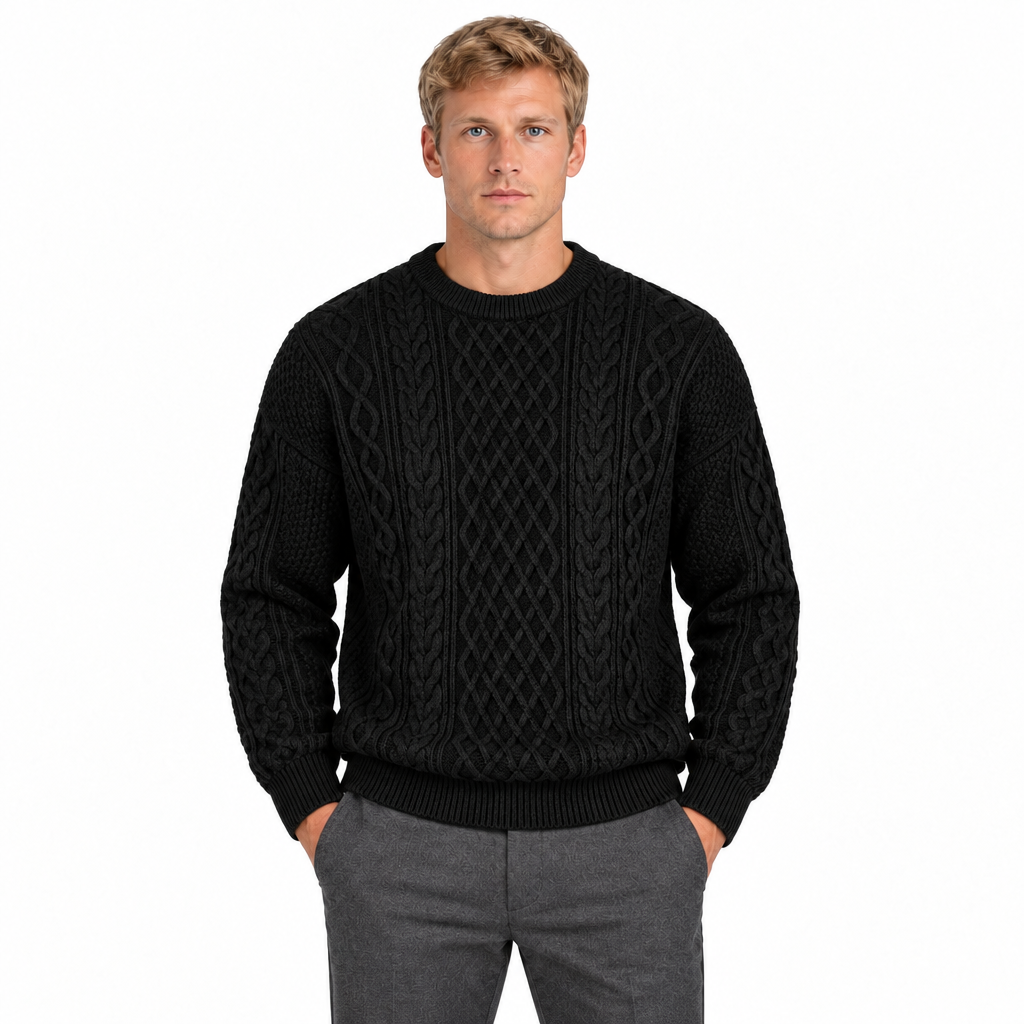 Men's black cable knit crew neck jumper — front view, model with hands in trouser pockets