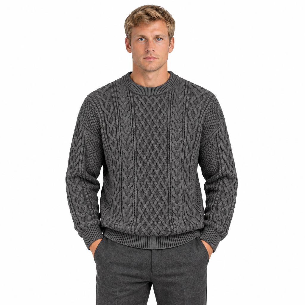 Men's grey cable knit crew neck jumper — front view, model with hands in trouser pockets