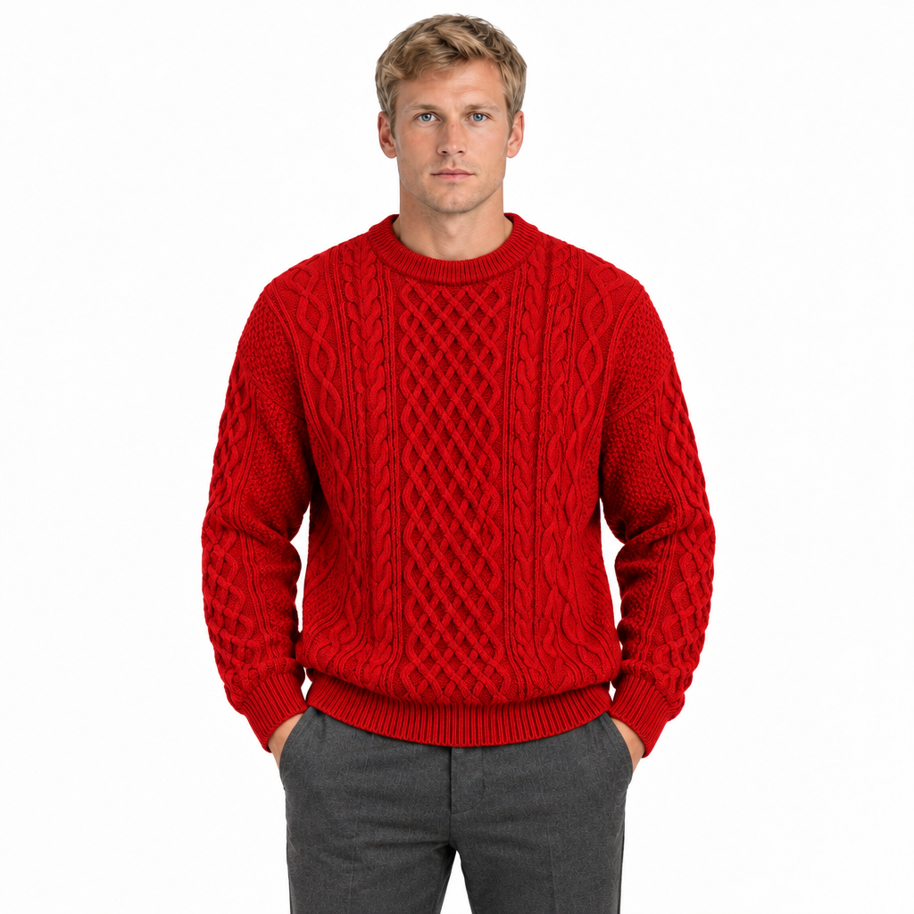 Men's red cable knit crew neck jumper — front view, model with hands in trouser pockets